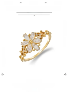 Close-up of 14K gold plated silver flower ring with marquise synthetic opal petals