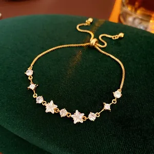 Adjustable gold star and round zircon bracelet for women on green velvet