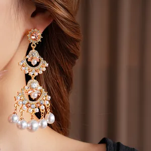 Vintage fan-shaped tassel earrings with gold plating, pearls and sparkling crystals