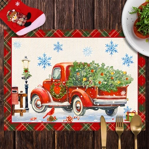 Close-up of a festive Christmas placemat with red truck and tree on a wooden table