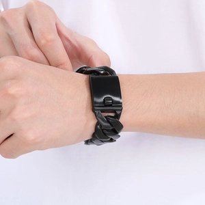 Close-up of a 24mm black vacuum-plated stainless steel Cuban link bracelet for men