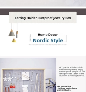 Detail of wooden jewelry organizer wall mount with gray felt lining and metal hooks