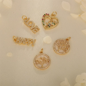 Gold plated Tree of Life and LOVE heart pendants with cubic zirconia on white petals