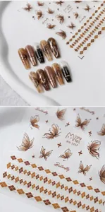 Detail of embossed butterfly nail stickers with gold accents and brown lattice patterns