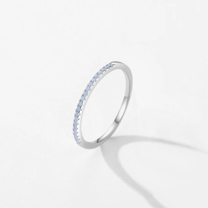 Minimalist S925 silver ring with small light blue crystals in a slim eternity band design