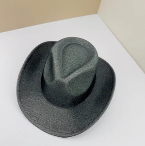 Close-up of a dark grey frosted western cowboy hat with a stylish rolled edge.