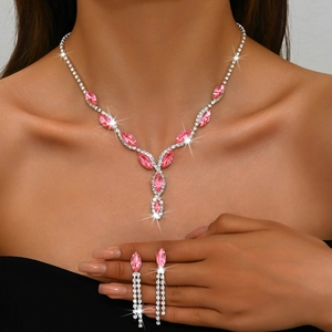 Close-up of a pink marquise gemstone bridal necklace and matching tassel earrings set