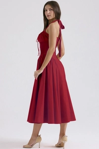 Detail showing backless design and cinched waist of this red halter neck summer maxi dress