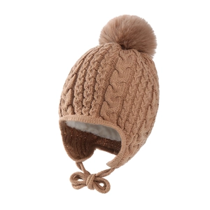 Detailed view of winter baby knit hat with warm lamb wool lining and twist braid pattern