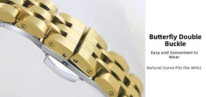 Detail of two-tone gold and silver metal watch band with butterfly double push button clasp