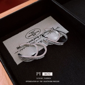 Double-layered silver hoops with cubic zirconia stones in a luxury gift box display