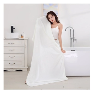 Thickened white coral fleece bath towel with waffle texture for high water absorption