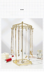 Detailed close-up of golden iron art jewelry display stand with 18 rotating metal hooks