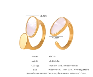 Detailed view of titanium steel gold ring with white sea shell inlay and dimensions