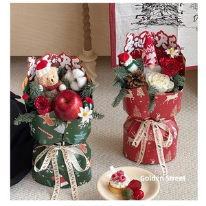 Detailed view of Christmas bouquet with teddy bear, pine cones and Merry Christmas ribbons