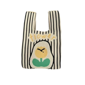 Knitted stripe bucket bag in beige with black stripes and a yellow flower pattern
