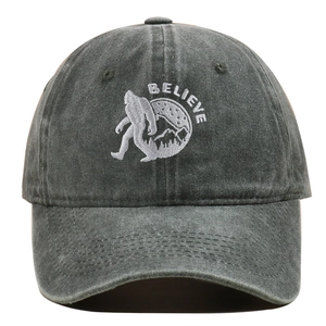 Detail of BELIEVE embroidery with Sasquatch and mountains on vintage washed baseball cap