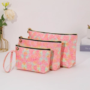 Three-piece set of pink sequin lace cosmetic bags in various sizes with gold zippers