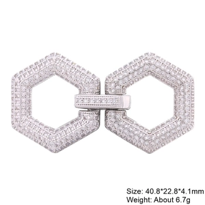 Detailed view of silver hexagonal jewelry clasp encrusted with clear zircon stones