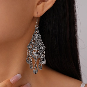 Vintage hollow flower teardrop tassel earrings in silver bohemian style for women
