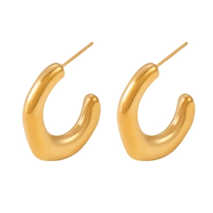 Polished 18k gold plated chunky C-shaped irregular hoop earrings on white background
