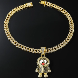 Detail of hip hop gold Cuban chain with iced out cartoon pendant and secure box clasp
