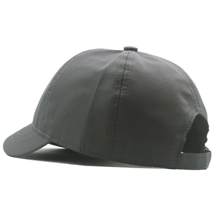 Detail of dark grey baseball cap showing honeycomb tech fabric and adjustable strap