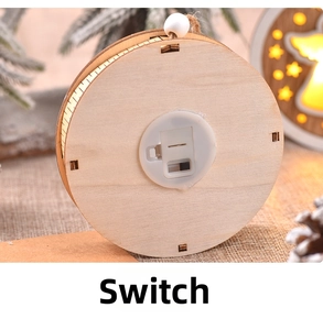 Detailed back view of a wooden Christmas ornament with a battery pack and switch