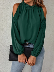 Detailed view of cold-shoulder cut-outs and ruffled neckline on dark green chiffon blouse