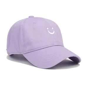 Detail showing high-quality purple cotton fabric and white smiley face embroidery on cap