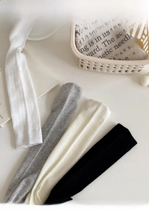 Detailed knit texture of breathable cotton slouch socks in multiple neutral colors