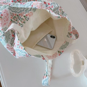 Internal view of floral cotton tote showing a handy inner pocket for mobile storage