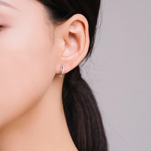 Minimalist S925 sterling silver geometric hoop earrings with small diamonds on a model