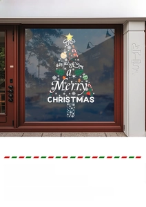 Detail of Christmas tree window decal with Merry Christmas text on glass storefront