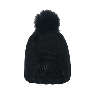 Classic black knitted beanie for women featuring a large faux fur pompom for winter warmth