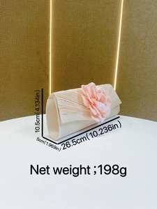 Detailed view of champagne pleated evening clutch bag with pink flower decoration and size specs.