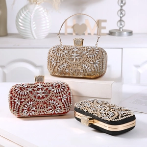 Three elegant evening clutch bags in gold, red, and black with hollowed metal and rhinestones
