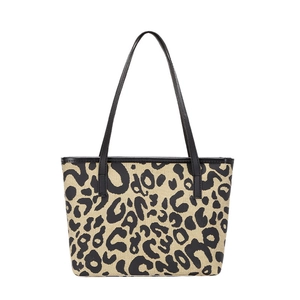 Stylish leopard print canvas tote bag with black leather straps on white background