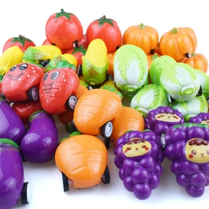 Macro view of assorted colorful vegetable and fruit pull-back toy cars for children