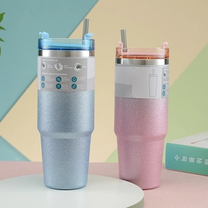 Close-up of dual-layer vacuum insulated tumblers with glitter finish and 3-way lids