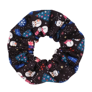 Detail of Christmas scrunchie featuring snowmen and trees on black elastic fabric