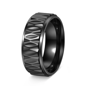 Macro view of men's black stainless steel ring with 3D geometric diamond texture