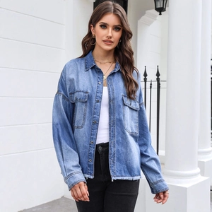 Vintage wash light blue denim shirt with frayed hem and drop shoulder for women