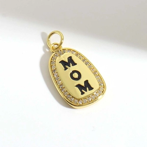 Elegant gold oval MOM pendant with black enamel letters and sparkling cubic zirconia halo