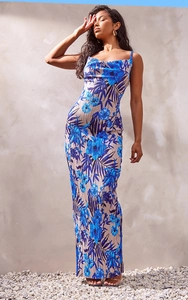 Detail of blue floral print on beige pleated slim fit spaghetti strap maxi dress