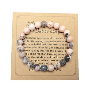 Green Aventurine and Moonstone bracelet on a brown healing property gift card