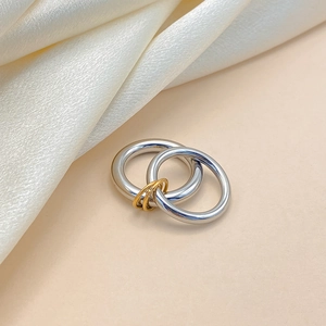 Polished silver and gold interconnected multi-loop ring in minimalist stainless steel