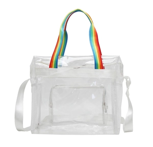Detailed view of clear PVC beach bag featuring rainbow handles and white shoulder straps