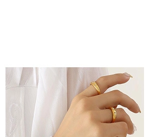 Close-up of elegant gold-plated zircon rings worn on a hand for a luxury jewelry showcase