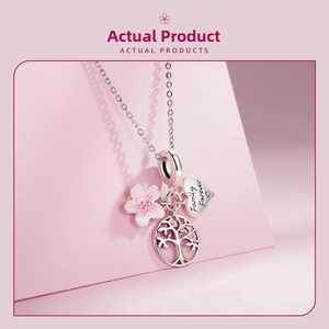 Macro view of S925 silver charms including pink cherry blossom and Family Forever heart